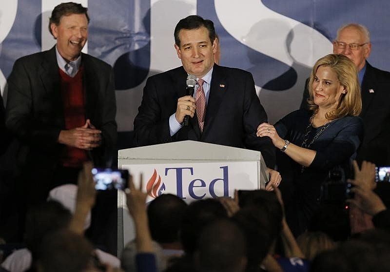 U.S. Republican presidential candidate Ted Cruz speaks, with his wife Heidi Cruz by his side, after winning at his Iowa caucus night rally in Des Moines, Iowa, February 1, 2016. REUTERS/Jim Young