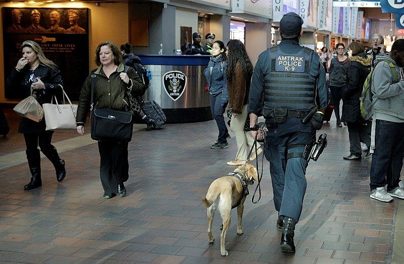 A police officer with a dog patrol in Union Station in Washington March 22, 2016. REUTERS/Joshua Roberts