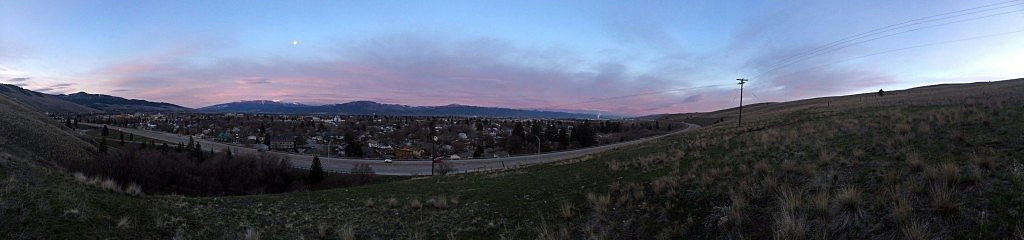 The sun rises and the moon sets over the Missoula Valley on Eastern morning. (Photo by Martin Kidston)