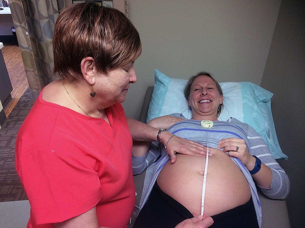 Nurse midwife Brenda DeGrazio examines expecting mother Brianna Tripke recently at Providence St. Patrick Hospital's new midwifery program. (Photo by Martin Kidston)