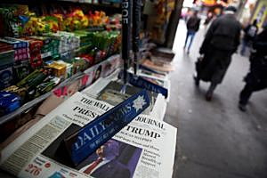 The cover of the Wall Street Journal newspaper is seen with other papers at a news stand in New York U.S., November 9, 2016. REUTERS/Shannon Stapleton